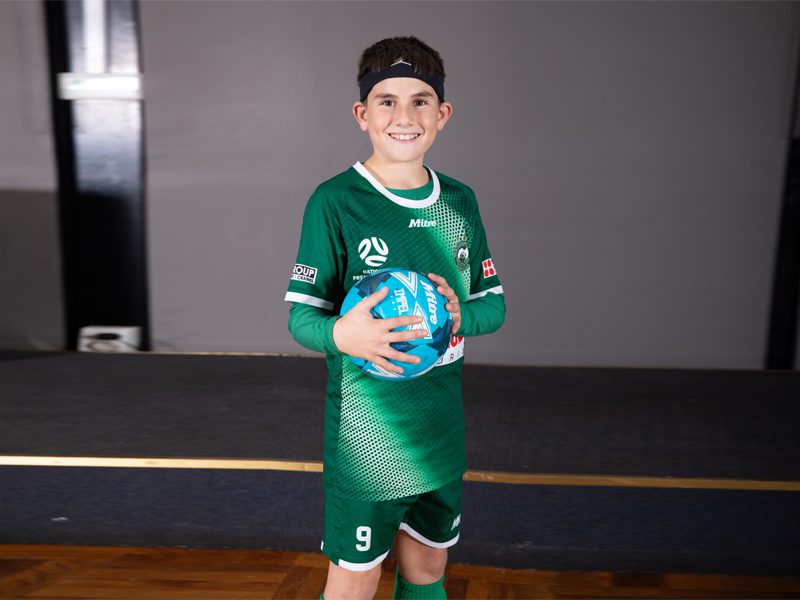 School Boy In Football jersey - School Photo Editing Service - Before image by Smart Clipping (smartclipping.io)