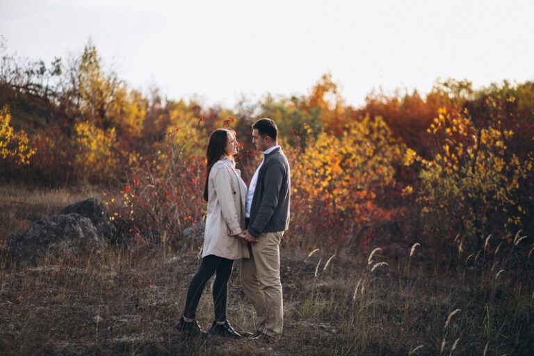 Fall engagement photo ideas - Young couple together in an autumn nature