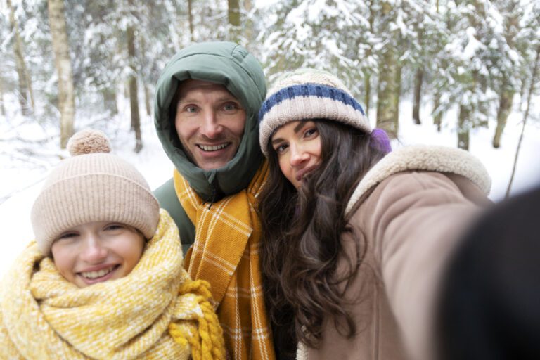 close-up-smiley-people-taking-selfie - winter family photo outfit ideas