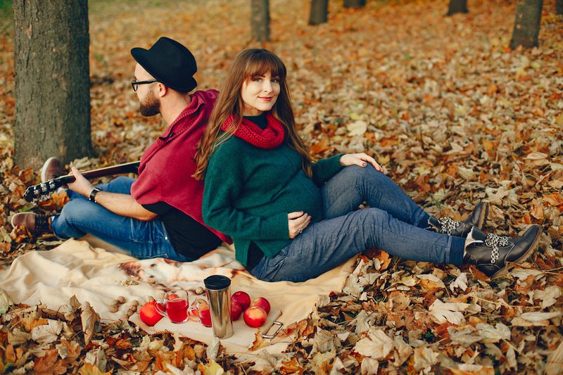 Elegant couple spend time in a autumn park