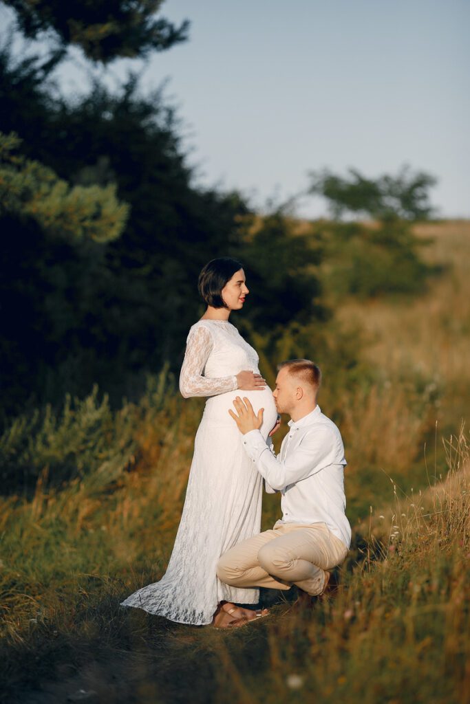 Maternity photography ideas - Partner Kissing Belly