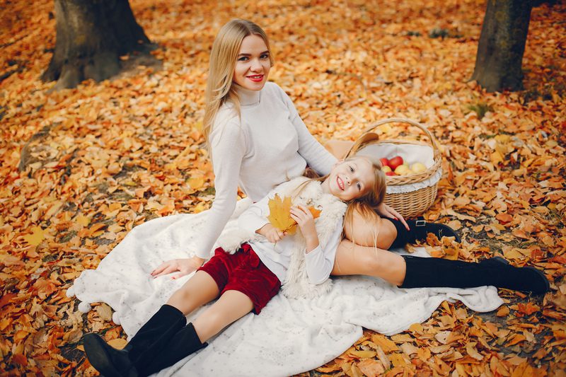 Cute and stylish family in a autumn park