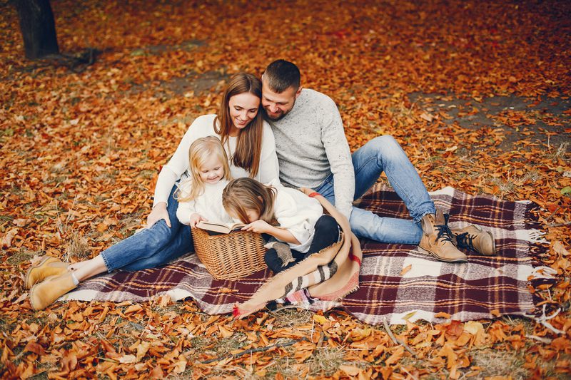 Family with cute kids in a autumn park