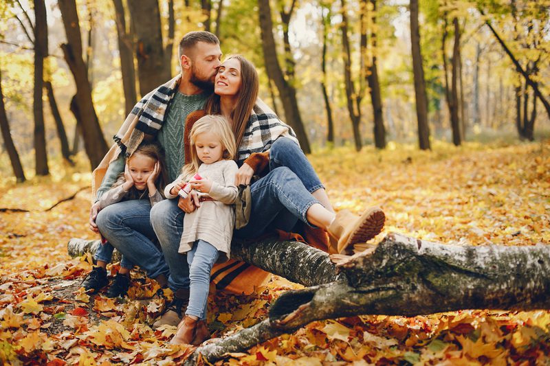 Family with cute kids in a autumn park