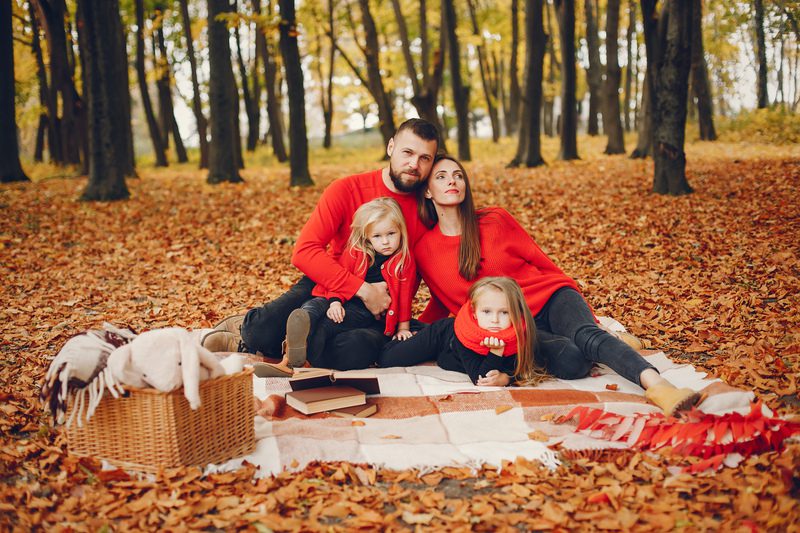 Family with cute kids in a autumn park - Fall Family Photo Ideas