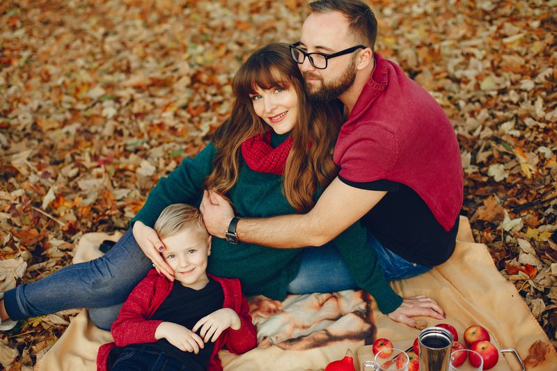 Family with little son in a autumn park