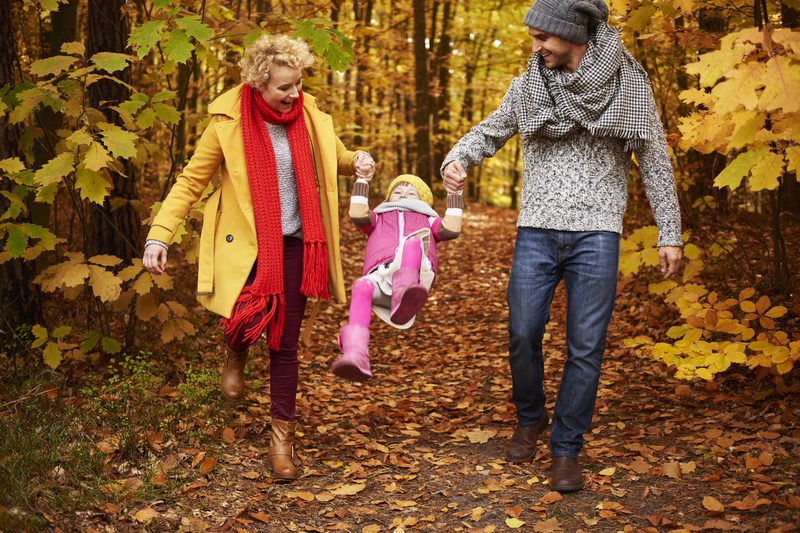 Parents lifting daughter in the air