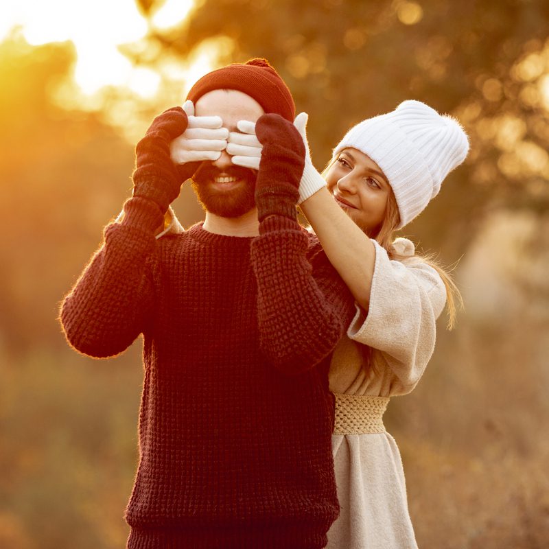 woman-covering-her-boyfriend-eyes