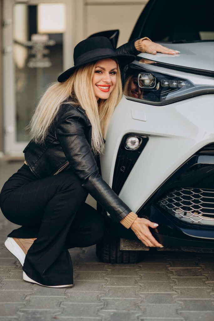 Woman hugging new white car