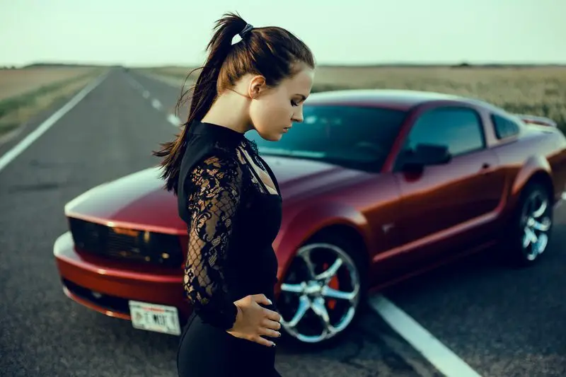 Young beautiful girl posing near the expensive red car, powerful car by Smart Clipping