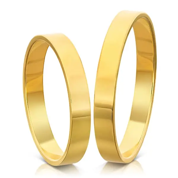 Two polished plain gold wedding bands on a white background.