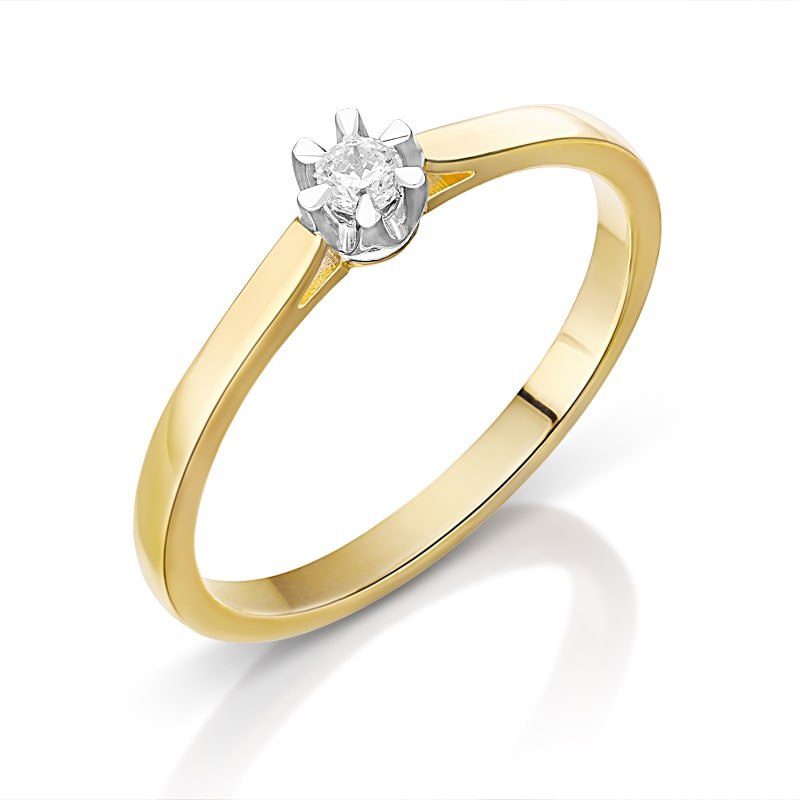 Gold ring with a single round diamond set in a white gold prong setting and smooth band.