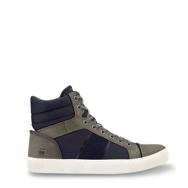High-top sneaker in dark blue fabric and olive green suede with white rubber sole and padded ankle.