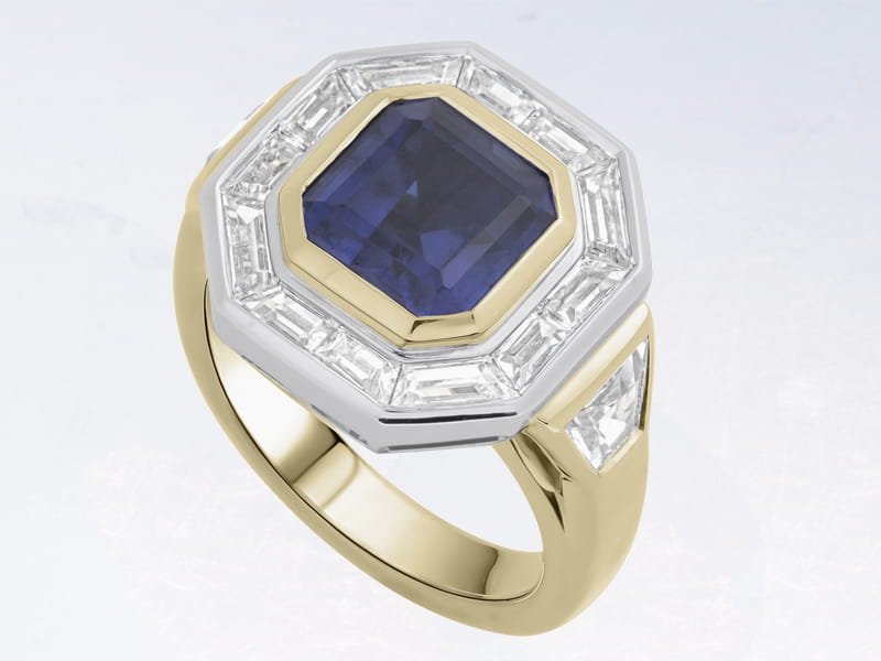 Gold-toned lever-back earring with a faceted dark green oval gemstone